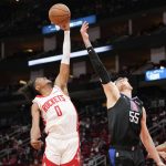 
              Houston Rockets guard Jalen Green (0) grabs a rebound over Los Angeles Clippers center Isaiah Hartenstein (55) during the second half of an NBA basketball game, Sunday, Feb. 27, 2022, in Houston. (AP Photo/Eric Christian Smith)
            