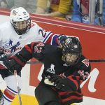 
              United States' Kendall Coyne-Schofield (26) pursues Canada's Claire Thompson along the boards during the first period of a women's exhibition hockey game billed as the "Rivalry Rematch", Saturday, March 12, 2022, in Pittsburgh. (AP Photo/Keith Srakocic)
            