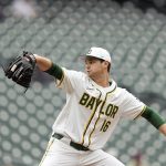 
              Baylor pitcher Tyler Thomas throws during first inning of a Shriners Children's College Classic baseball game against UCLA, at Minute Maid Park, home of the Houston Astros, Friday, March 4, 2022, in Houston. College baseball might turn out to be an attractive alternative for baseball fans if the Major League Baseball lockout extends deep into the spring. (AP Photo/David J. Phillip)
            