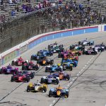 
              Racers vie for position at the beginning of the NTT IndyCar Series XPEL 375 at Texas Motor Speedway in Fort Worth, Texas, on Sunday, March 20, 2022. (AP Photo/Larry Papke)
            