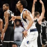 
              Dallas Mavericks guard Spencer Dinwiddie (26) reacts after scoring the game-winning three point shot at the buzzer in the second half of an NBA basketball game against the Brooklyn Nets, Wednesday, March 16, 2022, in New York. (AP Photo/John Minchillo)
            