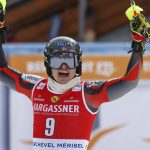 
              Norway's Atle Lie McGrath celebrates winning an alpine ski, men's World Cup slalom, in Meribel, France, Sunday, March 20, 2022. (AP Photo/Alessandro Trovati)
            