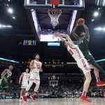 
              Michigan State's Julius Marble II (34) shoots over Wisconsin's Chris Vogt (33) during the first half of an NCAA college basketball game at the Big Ten Conference tournament, Friday, March 11, 2022, in Indianapolis. (AP Photo/Darron Cummings)
            