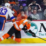 
              Philadelphia Flyers' James van Riemsdyk, right, collides with New York Islanders' Zdeno Chara during the second period of an NHL hockey game, Sunday, March 20, 2022, in Philadelphia. (AP Photo/Matt Slocum)
            