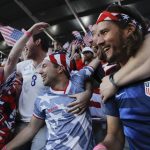 
              Fans from Charleston, S.C., react after a goal by the United States during the first half of a FIFA World Cup qualifying soccer match against Panama, Sunday, March 27, 2022, in Orlando, Fla. (AP Photo/Julio Cortez)
            