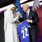 
              Prime Minister of the State of Qatar, Khalid Bin Khalifa Bin Abdulaziz Al Thani, left, receives a gift from FIFA President Gianni Infantino during the FIFA congress at the Doha Exhibition and Convention Center in Doha, Qatar, Thursday, March 31, 2022. (AP Photo/Hassan Ammar)
            