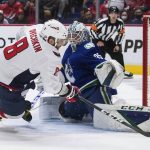 
              Vancouver Canucks goalie Thatcher Demko, right, stops Washington Capitals' Alex Ovechkin during the third period of an NHL hockey game Friday, March 11, 2022, in Vancouver, British Columbia. (Darryl Dyck/The Canadian Press via AP)
            