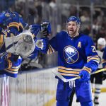 
              Buffalo Sabres left wing Zemgus Girgensons is congratulated after scoring against the Winnipeg Jets during the first period of an NHL hockey game in Buffalo, N.Y., Wednesday, March 30, 2022. (AP Photo/Adrian Kraus)
            