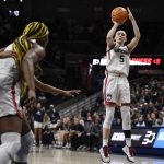 
              Connecticut's Paige Bueckers (5) shoots during the first half of a second-round women's college basketball game against Central Florida in the NCAA tournament, Monday, March 21, 2022, in Storrs, Conn. (AP Photo/Jessica Hill)
            