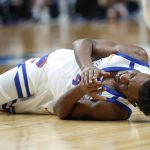 
              Boise State forward Abu Kigab (24) reacts after going down on a play against Memphis during the first half of a first round NCAA college basketball tournament game, Thursday, March 17, 2022, in Portland, Ore. (AP Photo/Craig Mitchelldyer)
            