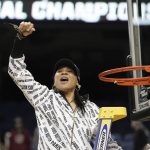 
              South Carolina head coach Dawn Staley reacts while cutting the net following a college basketball game against Creighton in the Elite 8 round of the NCAA tournament in Greensboro, N.C., Sunday, March 27, 2022. (AP Photo/Gerry Broome)
            