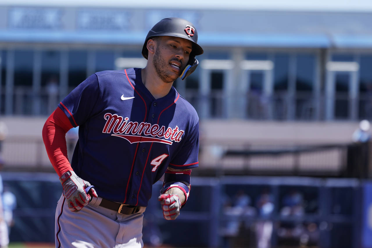 Minnesota Twins shortstop Carlos Correa rounds third after a solo home run in the fourth inning dur...