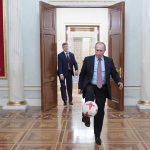 
              FILE - Russian President Vladimir Putin, foreground, plays with an official match ball for the 2017 FIFA Confederations Cup received from FIFA President Gianni Infantino, after their meeting in the Kremlin in Moscow, Russia, Friday, Nov. 25, 2016. Russian teams have been suspended from all international soccer, including qualifying matches for the 2022 World Cup, as Moscow was pushed toward pariah status in sports for its invasion of Ukraine. World soccer body FIFA and European authority UEFA banned Russian national and club teams from their competitions "until further notice," taking Russia's men's national team out of World Cup qualifying playoffs in three weeks' time. (Alexei Druzhinin, Sputnik, Kremlin Pool Photo via AP, File)
            