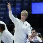 
              Alabama head coach Kristy Curry directs her players in the first half of an NCAA college basketball game against Georgia at the women's Southeastern Conference tournament Thursday, March 3, 2022, in Nashville, Tenn. (AP Photo/Mark Humphrey)
            