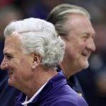 
              Kansas State coach Bruce Webber, front, passes West Virginia coach Bob Huggins before an NCAA college basketball game in the first round of the Big 12 Conference tournament in Kansas City, Mo., Wednesday, March 9, 2022. (AP Photo/Charlie Riedel)
            