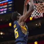 
              Indiana Pacers forward Jalen Smith (25) scores during the second half of an NBA basketball game against the Atlanta Hawks, Sunday, March 13, 2022, in Atlanta. (AP Photo/Hakim Wright Sr.)
            