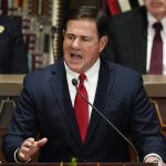 
              FILE — Arizona Republican Gov. Doug Ducey gives his state of the state address at the Arizona Capitol, Monday, Jan. 10, 2022, in Phoenix. GOP lawmakers thrust Arizona into the national culture wars Thursday, March 24, 2022, when they passed three bills in party-line votes banning abortion after 15 weeks, prohibiting transgender girls from playing on girls sports teams and restricting gender-affirming health care for minors. (AP Photo/Ross D. Franklin, File)
            