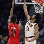 
              Cleveland Cavaliers' Jarrett Allen (31) blocks a shot against Toronto Raptors' Thaddeus Young (21) during the first half of an NBA basketball game, Sunday, March 6, 2022, in Cleveland. (AP Photo/Ron Schwane)
            
