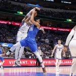 
              Dallas Mavericks guard Spencer Dinwiddie (26) has his shot attempt blocked by Sacramento Kings center Richaun Holmes (22) in the first half of an NBA basketball game in Dallas, Saturday, March, 5, 2022. Holmes was charged with a foul on the play. (AP Photo/Tony Gutierrez)
            