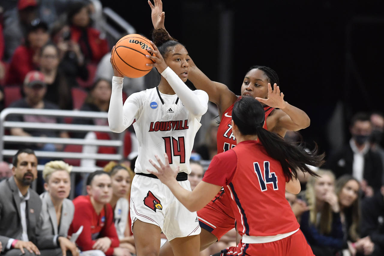 Louisville guard Kianna Smith (14) looks for help from pressure by Gonzaga guard Kaylynne Truong (1...