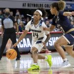 
              Longwood's Tra'Dayja Smith (14) drives against Mount St. Mary's Jada Lee, right, during the first half of an NCAA college basketball game in Raleigh, N.C., Thursday, March 17, 2022. (AP Photo/Ben McKeown)
            