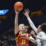
              Iowa State guard Emily Ryan (11) shoots while being guarded by West Virginia guard Savannah Samuel (24) during the second half of an NCAA college basketball game in Morgantown, W.Va., Saturday, March 5, 2022. (AP Photo/William Wotring)
            