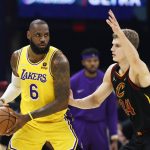 
              Los Angeles Lakers' LeBron James (6) plays against Cleveland Cavaliers' Lauri Markkanen (24) during the first half of an NBA basketball game, Monday, March 21, 2022, in Cleveland. (AP Photo/Ron Schwane)
            