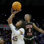 
              Jackson State forward Daja Woodard (0) blocks the shot of LSU guard Alexis Morris (45) in the second half of a women's college basketball game in the first round of the NCAA tournament, Saturday, March 19, 2022, in Baton Rouge, La. (AP Photo/Matthew Hinton)
            