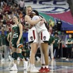 
              North Carolina State center Elissa Cunane, left, and forward Jada Boyd celebrate following an NCAA college basketball championship game against Miami at the Atlantic Coast Conference women's tournament in Greensboro, N.C., Sunday, March 6, 2022. (AP Photo/Gerry Broome)
            