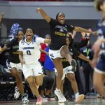 
              Longwood players run onto the court to celebrate their victory over Mount St. Mary's as time expires in the first-four round of the NCAA Women's Basketball Tournament in Raleigh, N.C., Thursday, March 17, 2022. (AP Photo/Ben McKeown)
            
