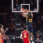 
              Indiana Pacers forward Isaiah Jackson (23) dunks during the first half of an NBA basketball game against the Atlanta Hawks, Sunday, March 13, 2022, in Atlanta. (AP Photo/Hakim Wright Sr.)
            