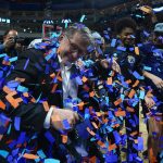 
              Connecticut head coach Geno Auriemma celebrates with players after defeating NC State in double overtime in the East Regional final college basketball game of the NCAA women's tournament, Monday, March 28, 2022, in Bridgeport, Conn. (AP Photo/Frank Franklin II)
            