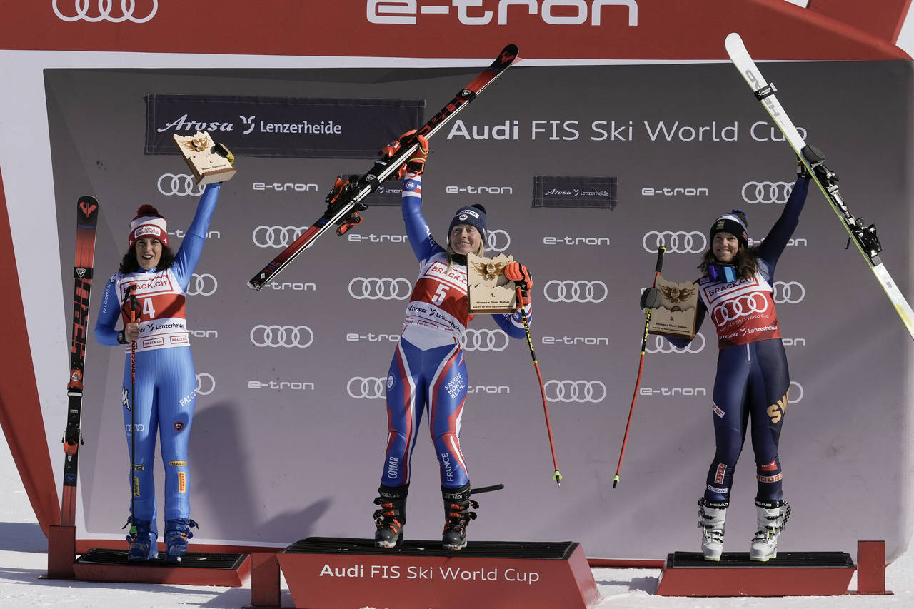 France's Tessa Worley, center, winner of an alpine ski, women's World Cup giant slalom, celebrates ...