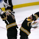 
              Boston Bruins goaltender Linus Ullmark, left, celebrates with goaltender Jeremy Swayman after the Bruins defeated the New Jersey Devils 8-1 in an NHL hockey game, Thursday, March 31, 2022, in Boston. (AP Photo/Charles Krupa)
            