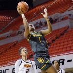 
              Baylor forward NaLyssa Smith (1) shoots in front of Oklahoma State guard Neferatali Notoa (2) in the first half of an NCAA college basketball game Wednesday, Feb. 23, 2022, in Stillwater, Okla. (AP Photo/Sue Ogrocki)
            