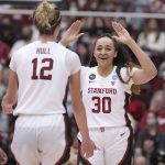 
              Stanford's Haley Jones (30) celebrates with Lexie Hull (12) after Hull made a 3-point basket against Kansas during the second half of a second-round game in the NCAA women's college basketball tournament Sunday, March 20, 2022, in Stanford, Calif. (AP Photo/Tony Avelar)
            