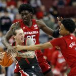 
              Nebraska center Eduardo Andre, rear, fouls Ohio State guard Jimmy Sotos, left, in front of Nebraska guard Alonzo Verge during the first half of an NCAA college basketball game in Columbus, Ohio, Tuesday, March 1, 2022. (AP Photo/Paul Vernon)
            