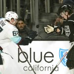
              Seattle Kraken center Morgan Geekie, left, and Los Angeles Kings defenseman Troy Stecher vie for a loose puck during the first period of an NHL hockey game Monday, March 28, 2022, in Los Angeles. (AP Photo/Mark J. Terrill)
            