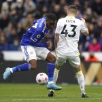 
              Leicester City's Ademola Lookman, left, and Leeds United's Mateusz Klich battle for the ball during the English Premier League soccer match between Leicester City and Leeds United at the King Power Stadium, Leicester, England, Saturday, March 5, 2022. (Mike Egerton/PA via AP)
            