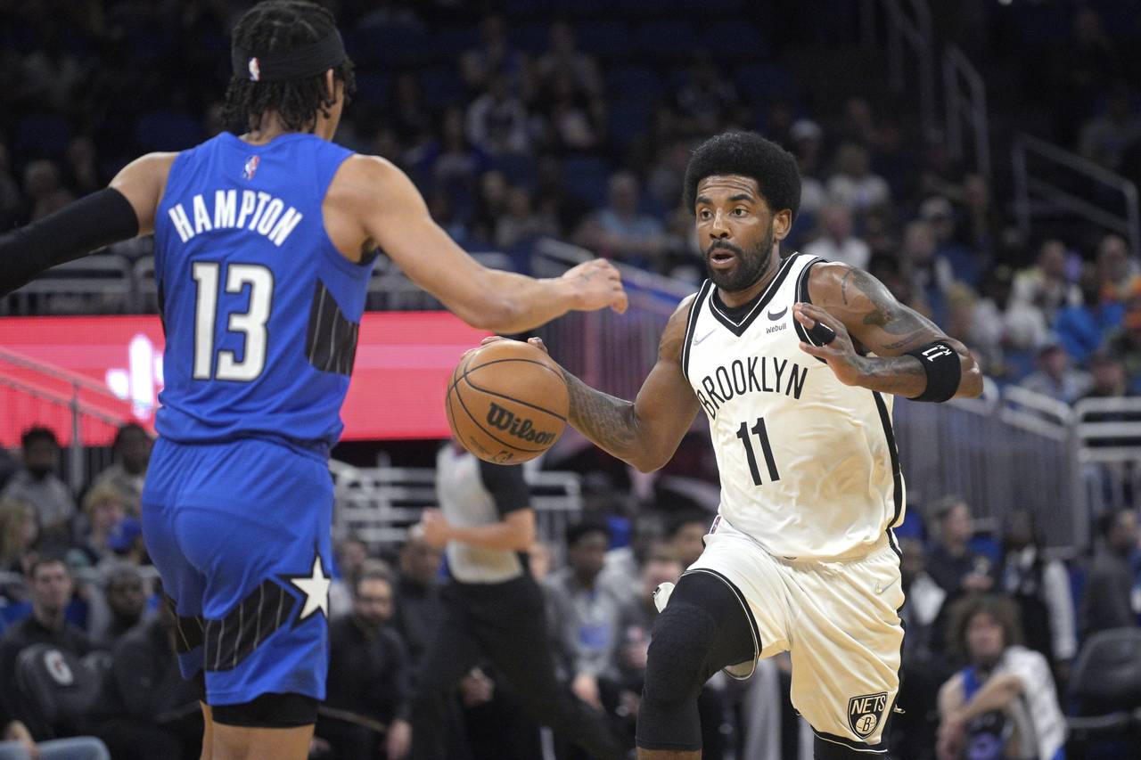 FILE - Brooklyn Nets guard Kyrie Irving (11), who is not permitted to play games in New York becaus...