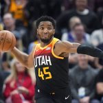 
              Utah Jazz guard Donovan Mitchell (45) brings the ball up during the second half of the team's NBA basketball game against the Los Angeles Lakers on Thursday, March 31, 2022, in Salt Lake City. (AP Photo/Rick Bowmer)
            