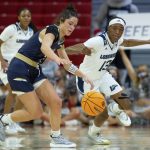 
              Mount St. Mary's Kendall Bresee, left, battles for the ball with Longwood's Akila Smith (13) during the first half of an NCAA college basketball game in Raleigh, N.C., Thursday, March 17, 2022. (AP Photo/Ben McKeown)
            