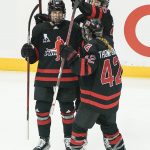 
              Canada's Blayre Turnbull, left, is congratulated by teammates Claire Thompson (42) and Micah Zander-Hart, right, after scoring against the United States during the first period of a women's exhibition hockey game billed as the "Rivalry Rematch", Saturday, March 12, 2022, in Pittsburgh. (AP Photo/Keith Srakocic)
            