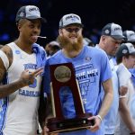 
              North Carolina's Armando Bacot, left, and Brady Manek celebrate after North Carolina won a college basketball game against St. Peter's in the Elite 8 round of the NCAA tournament, Sunday, March 27, 2022, in Philadelphia. (AP Photo/Chris Szagola)
            