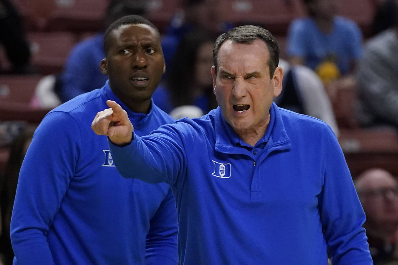 Duke head coach Mike Krzyzewski yells during the first half of a college basketball game against th...