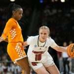 
              Louisville's Hailey Van Lith (10) heads to the basket as Tennessee's Jordan Walker defends during the first half of a college basketball game in the Sweet 16 round of the NCAA women's tournament Saturday, March 26, 2022, in Wichita, Kan. (AP Photo/Jeff Roberson)
            