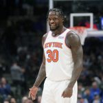 
              New York Knicks forward Julius Randle (30) smiles as he stands on the floor during the second half of an NBA basketball game against the Dallas Mavericks in Dallas, Wednesday, March 9, 2022. The Knicks won 107-77. (AP Photo/LM Otero)
            