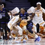 
              Buffalo guard Dyaisha Fair (2) drives past Tennessee guard Jordan Walker (4) during the first half of a college basketball game in the first round of the NCAA tournament, Saturday, March 19, 2022, in Knoxville, Tenn. (AP Photo/Wade Payne)
            
