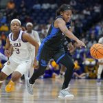 
              Kentucky's Robyn Benton, right, breaks away from LSU's Khayla Pointer (3) in the second half of an NCAA college basketball game at the women's Southeastern Conference tournament Friday, March 4, 2022, in Nashville, Tenn. (AP Photo/Mark Humphrey)
            