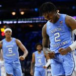 
              North Carolina's Caleb Love reacts during the second half of a college basketball game against UCLA in the Sweet 16 round of the NCAA tournament, Friday, March 25, 2022, in Philadelphia. (AP Photo/Chris Szagola)
            